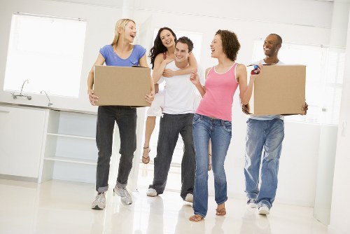 Moving boxes and furniture being handled at the start of a service agreement