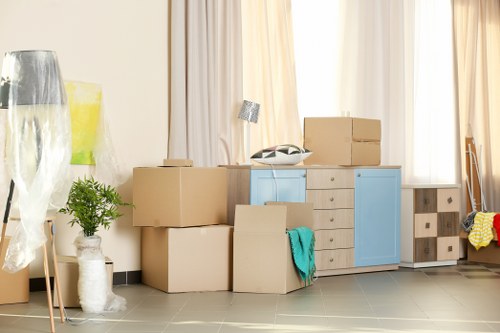 Clapham movers carrying furniture safely with insured protection