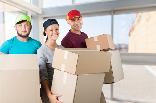 Local team collecting sofas and chairs from a Clapham property