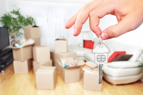 Professional movers handling large furniture items for a Clapham relocation