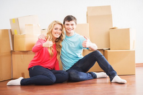 Movers carrying boxes through a Clapham property during relocation