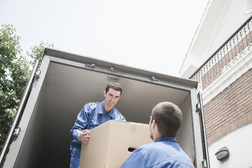 Staff handling furniture carefully during a house move