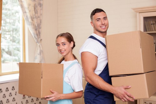 Packed household items and moving equipment ready for relocation