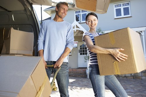 Packed moving boxes and furniture loaded into a removal truck