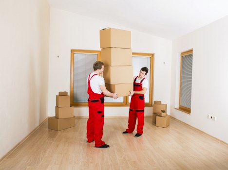 Team coordinating a move with protective handling measures